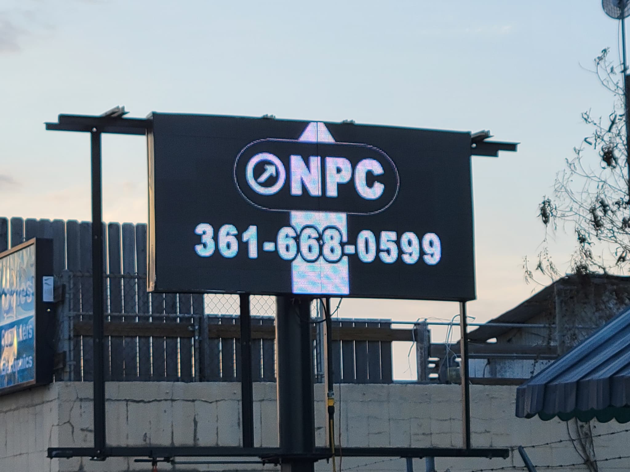 The NPC LED sign on Main showing the NPC logo and 361-668-0599